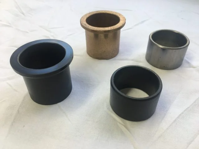 Low friction fork bushes