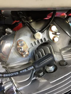 One piece rocker spindle plate fitment